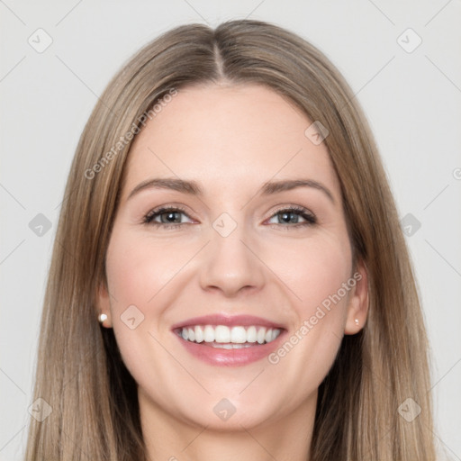 Joyful white young-adult female with long  brown hair and brown eyes