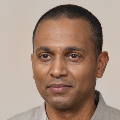 Neutral black adult male with short  black hair and brown eyes