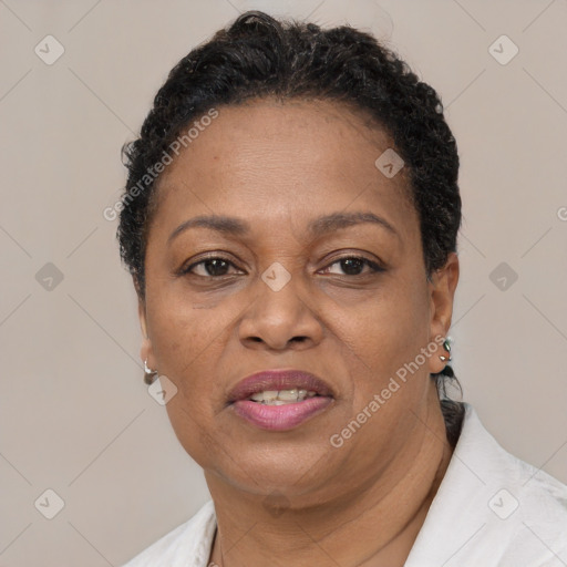 Joyful black adult female with short  brown hair and brown eyes