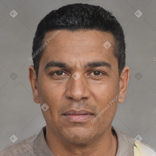 Joyful white adult male with short  black hair and brown eyes