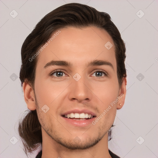 Joyful white young-adult male with medium  brown hair and brown eyes