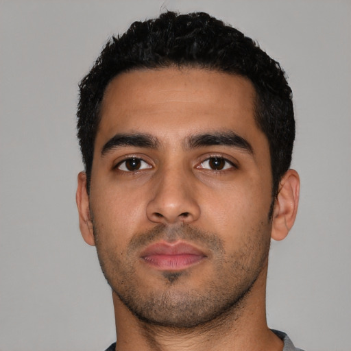 Neutral latino young-adult male with short  black hair and brown eyes