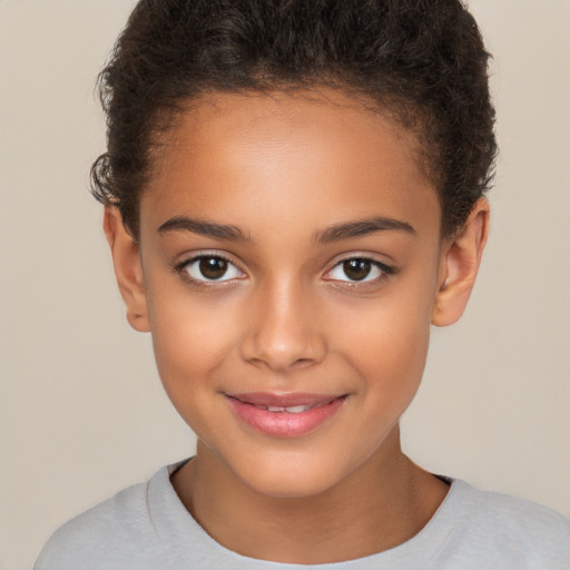 Joyful white child female with short  brown hair and brown eyes