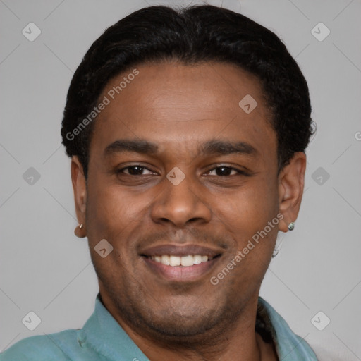 Joyful latino young-adult male with short  black hair and brown eyes