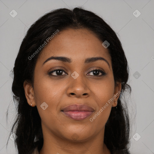 Joyful black young-adult female with long  brown hair and brown eyes