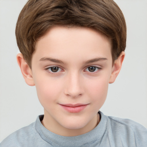 Joyful white child male with short  brown hair and brown eyes