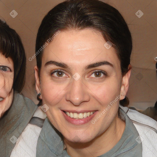 Joyful white adult female with medium  brown hair and brown eyes