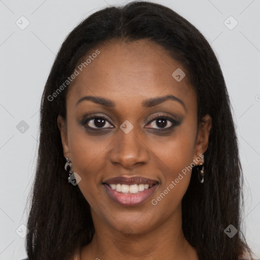 Joyful black young-adult female with long  brown hair and brown eyes