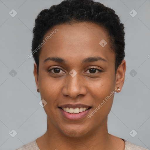 Joyful black young-adult female with short  black hair and brown eyes