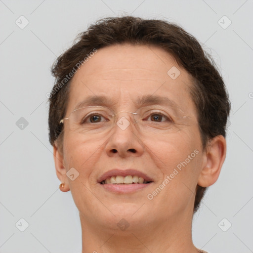 Joyful white adult female with short  brown hair and brown eyes