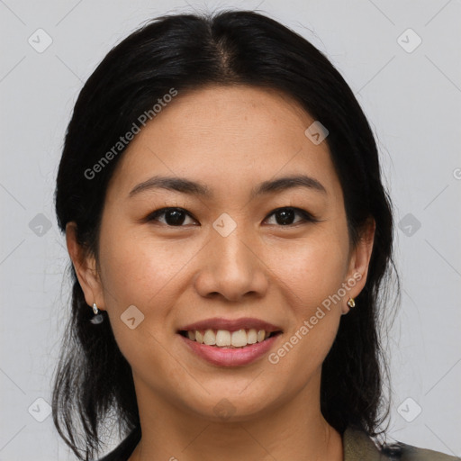 Joyful asian young-adult female with medium  black hair and brown eyes