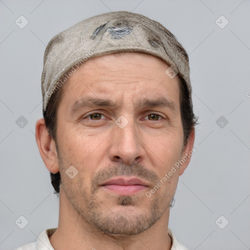 Joyful white adult male with short  brown hair and grey eyes