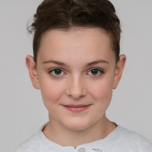 Joyful white child female with short  brown hair and brown eyes