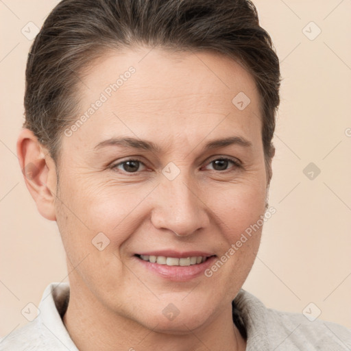 Joyful white adult female with short  brown hair and brown eyes