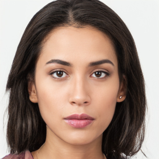 Neutral latino young-adult female with long  brown hair and brown eyes