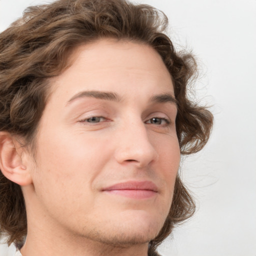 Joyful white young-adult male with medium  brown hair and brown eyes