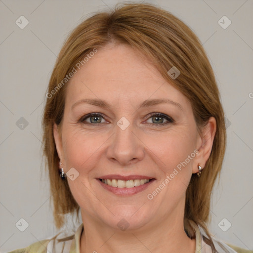 Joyful white adult female with medium  brown hair and grey eyes