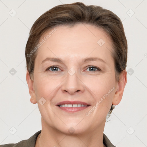 Joyful white adult female with short  brown hair and grey eyes