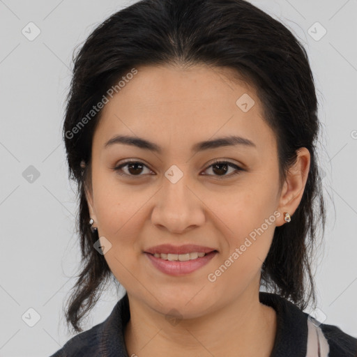 Joyful latino young-adult female with medium  brown hair and brown eyes