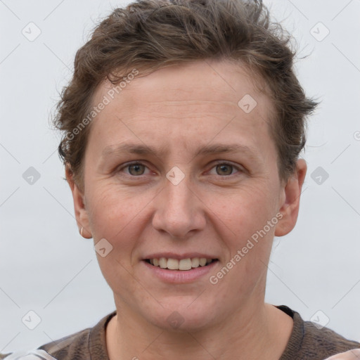 Joyful white adult female with short  brown hair and grey eyes