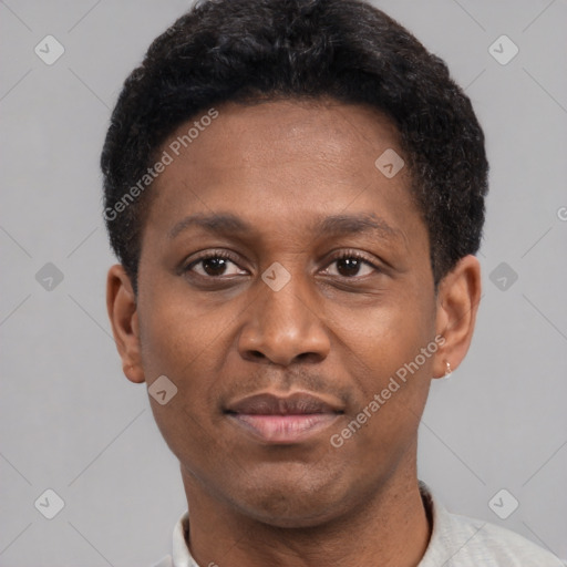 Joyful latino young-adult male with short  brown hair and brown eyes