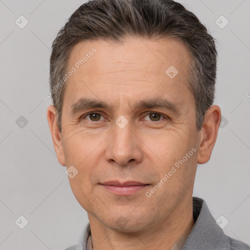 Joyful white adult male with short  brown hair and brown eyes