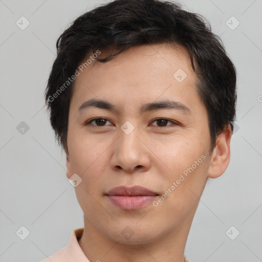 Joyful asian young-adult male with short  brown hair and brown eyes