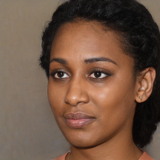 Neutral black young-adult female with long  black hair and brown eyes