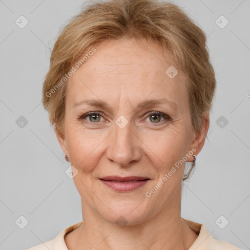 Joyful white adult female with short  brown hair and grey eyes