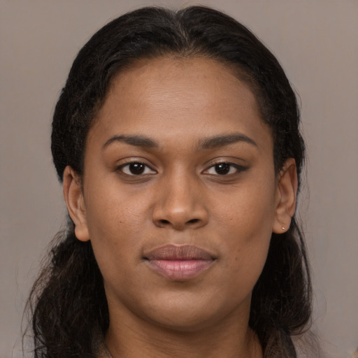 Joyful latino young-adult female with long  brown hair and brown eyes