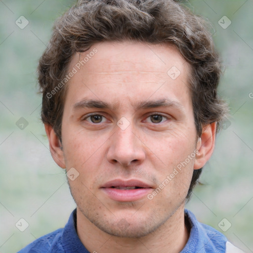 Joyful white adult male with short  brown hair and grey eyes