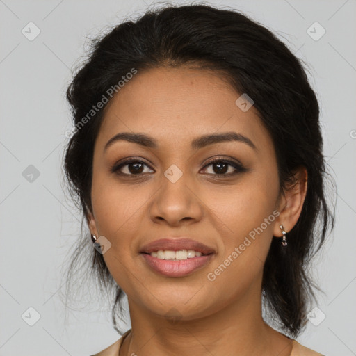 Joyful latino young-adult female with medium  brown hair and brown eyes