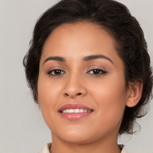 Joyful white young-adult female with long  brown hair and brown eyes