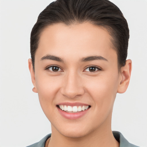 Joyful white young-adult female with short  brown hair and brown eyes