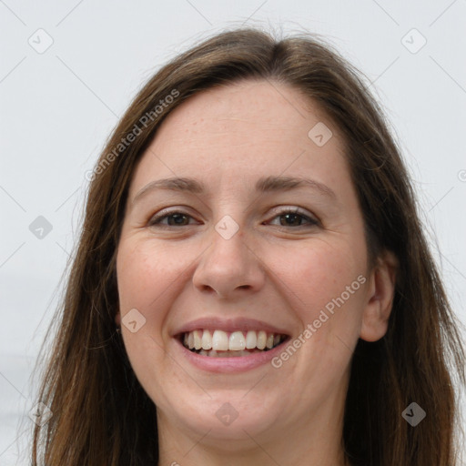 Joyful white young-adult female with long  brown hair and grey eyes