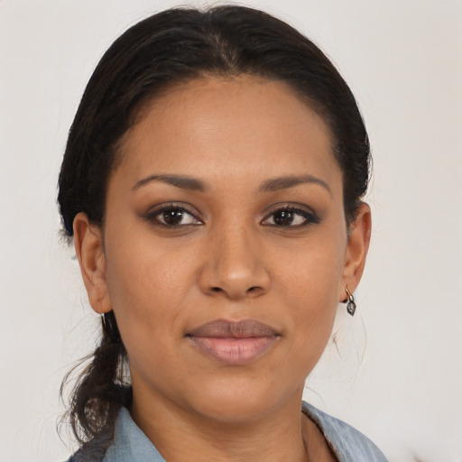 Joyful black young-adult female with medium  brown hair and brown eyes