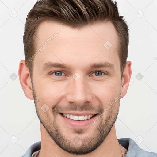 Joyful white young-adult male with short  brown hair and grey eyes