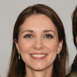 Joyful white young-adult female with medium  brown hair and brown eyes