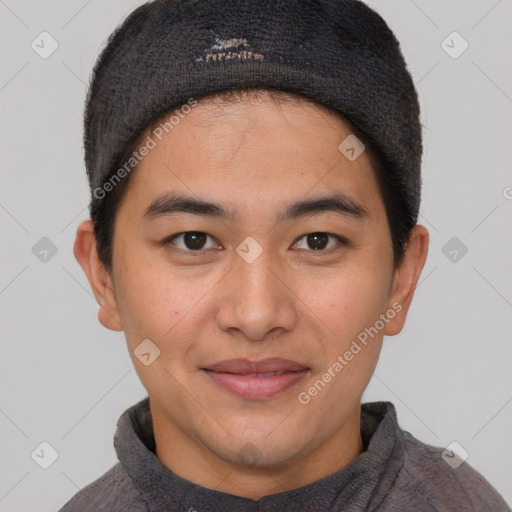 Joyful asian young-adult male with short  brown hair and brown eyes