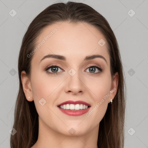 Joyful white young-adult female with long  brown hair and grey eyes