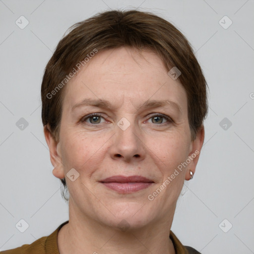 Joyful white adult female with short  brown hair and grey eyes