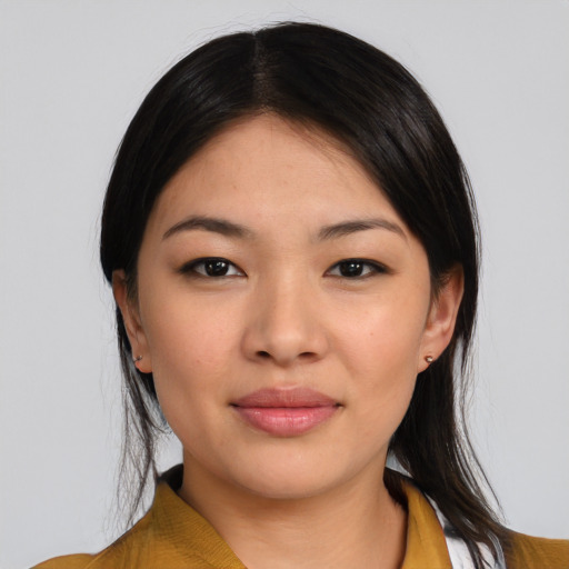 Joyful asian young-adult female with medium  black hair and brown eyes
