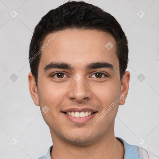 Joyful white young-adult male with short  black hair and brown eyes