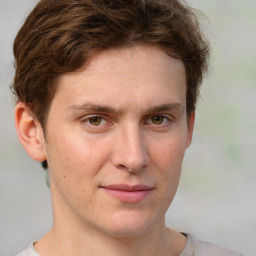 Joyful white adult male with short  brown hair and grey eyes