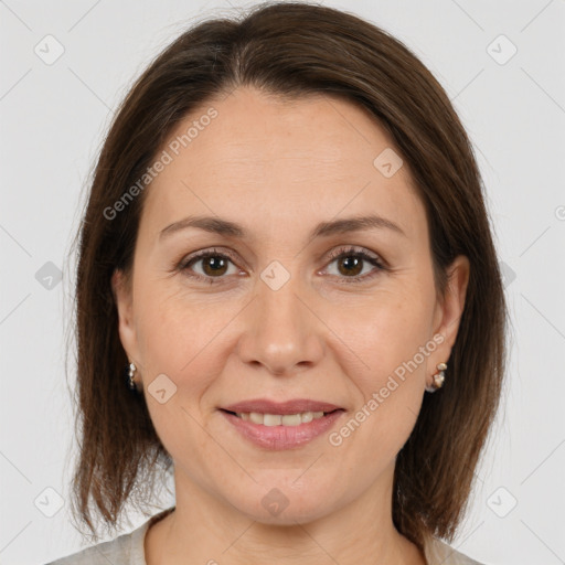 Joyful white adult female with medium  brown hair and brown eyes