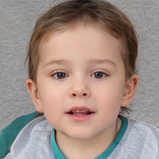 Joyful white child female with short  brown hair and blue eyes