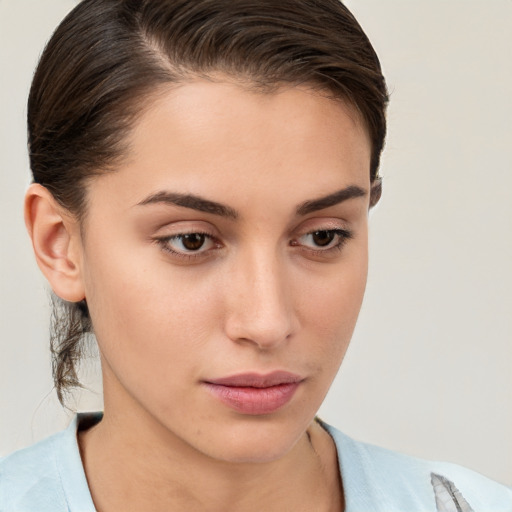 Neutral white young-adult female with medium  brown hair and brown eyes