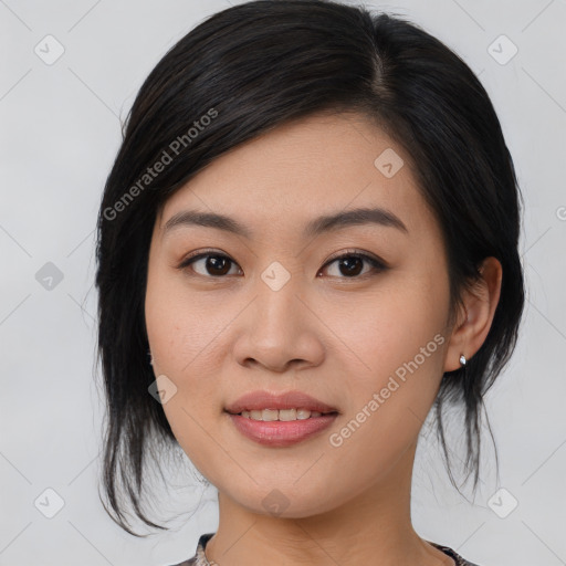 Joyful asian young-adult female with medium  black hair and brown eyes