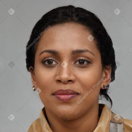 Joyful black young-adult female with short  black hair and brown eyes