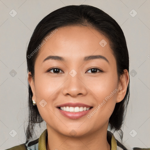 Joyful white young-adult female with medium  black hair and brown eyes